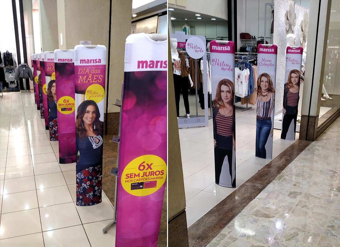 Capa personalizada em tecido instalada em totens de loja Marisa